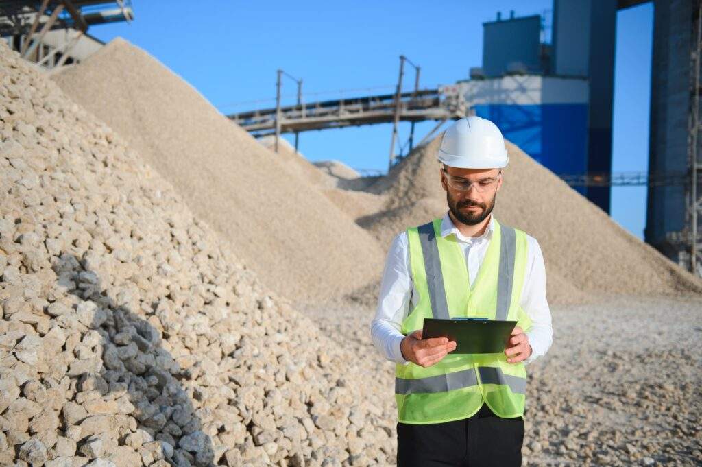 An engineer at a crushed stone or gravel plant. Stone mining